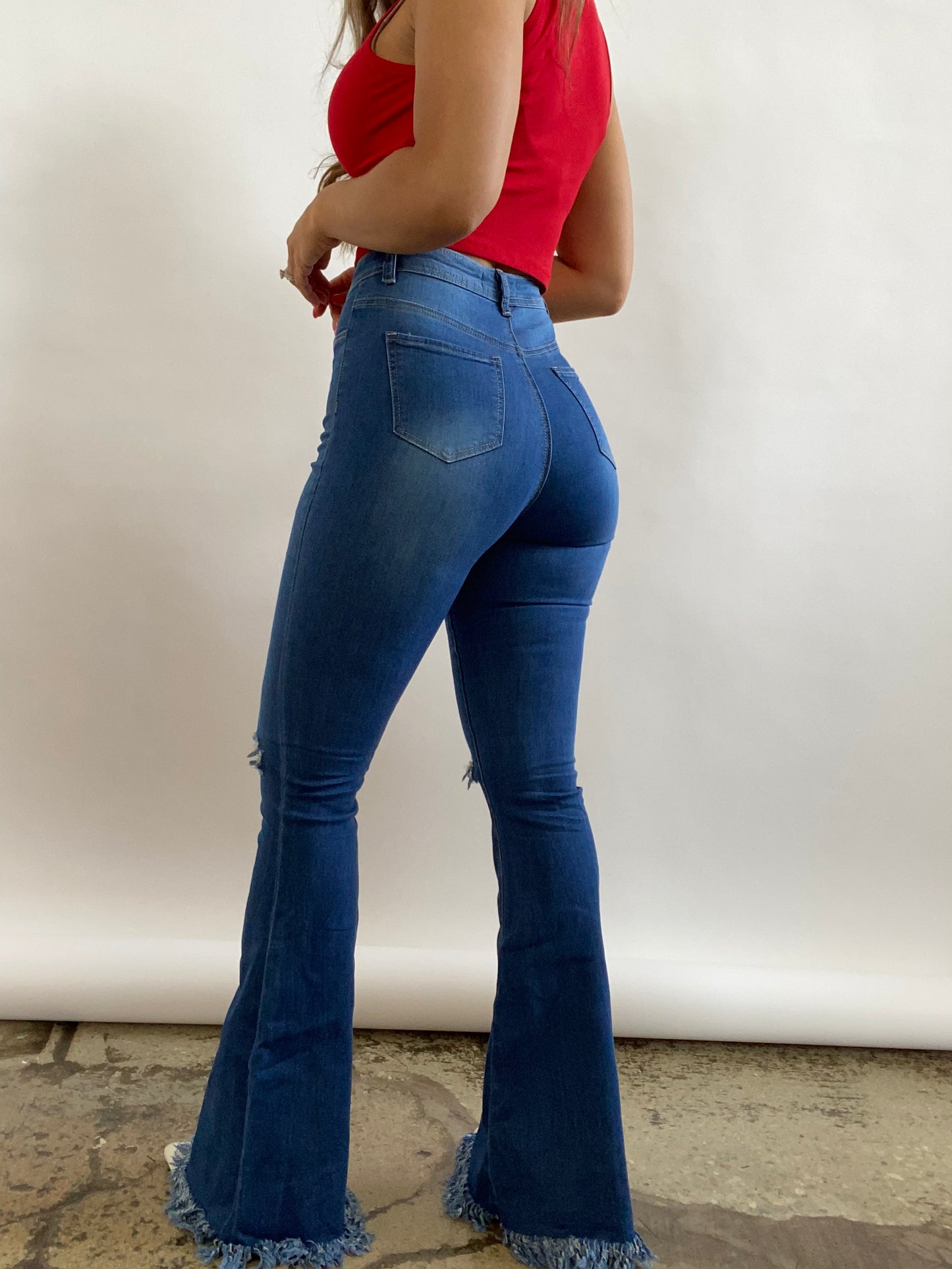 Buy our "Farrah Denim Distressed High Waisted Flares - Medium Wash" online – Willow Boutique Clothing. Shop stylish Farrah Denim Distressed High Waisted Flares - Medium Wash today.