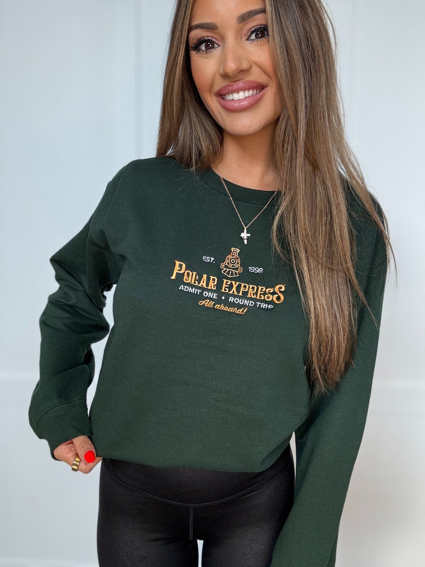 Shop Embroidered Polar Express Christmas Crewneck online at Willow Boutique – best boutique for women’s fashion.