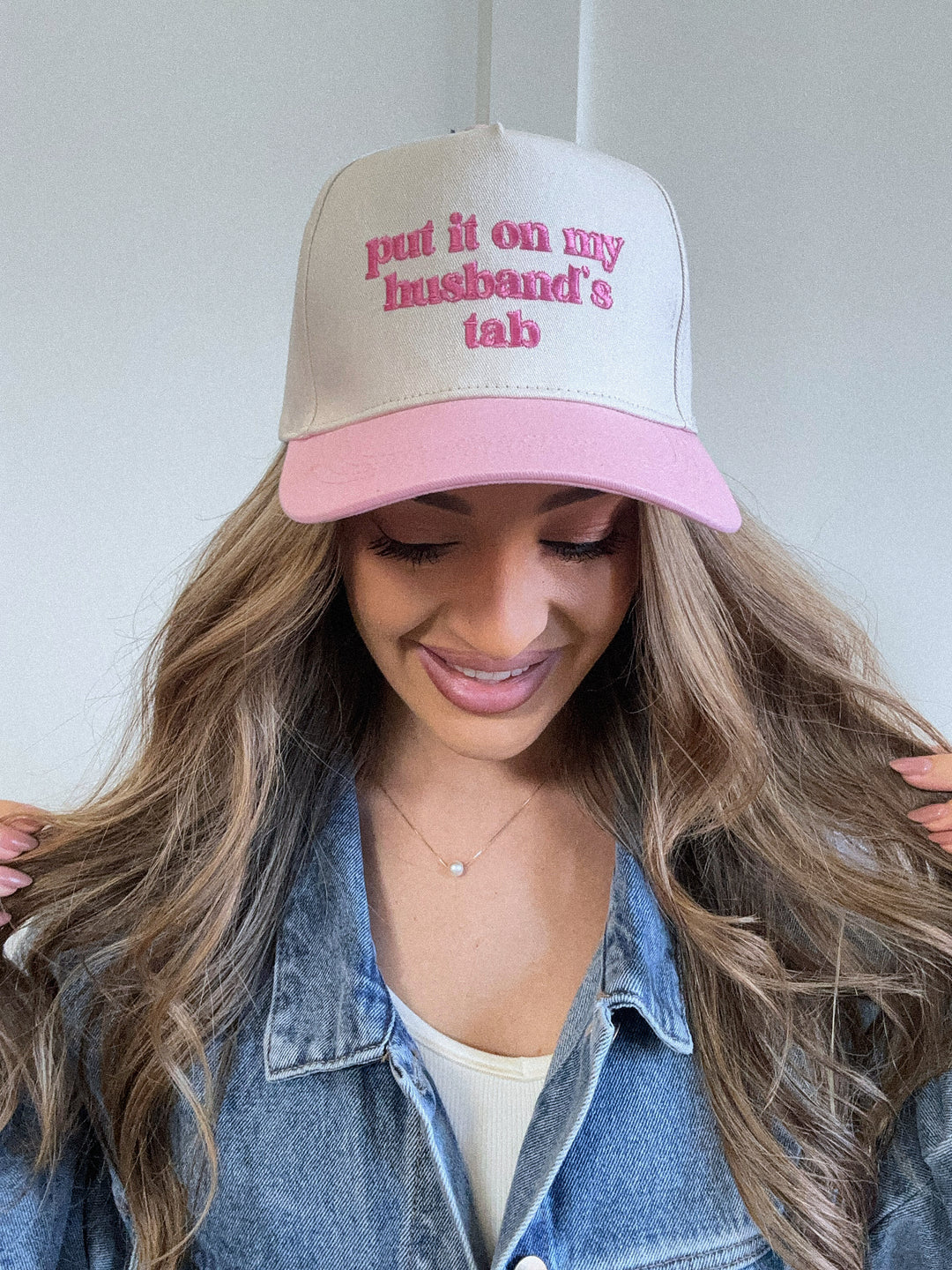 Put It On My Husbands Tab Trucker Hat