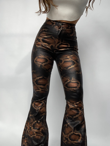 Buy our "Fiona High Waisted Bell Bottom Flare Jeans - Snakeprint" online – Willow Boutique Clothing. Shop stylish Fiona High Waisted Bell Bottom Flare Jeans - Snakeprint today.
