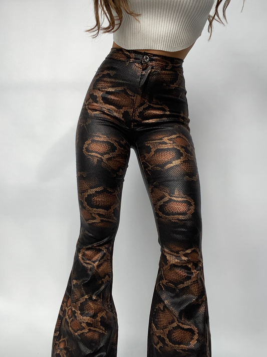 Buy our "Fiona High Waisted Bell Bottom Flare Jeans - Snakeprint" online – Willow Boutique Clothing. Shop stylish Fiona High Waisted Bell Bottom Flare Jeans - Snakeprint today.
