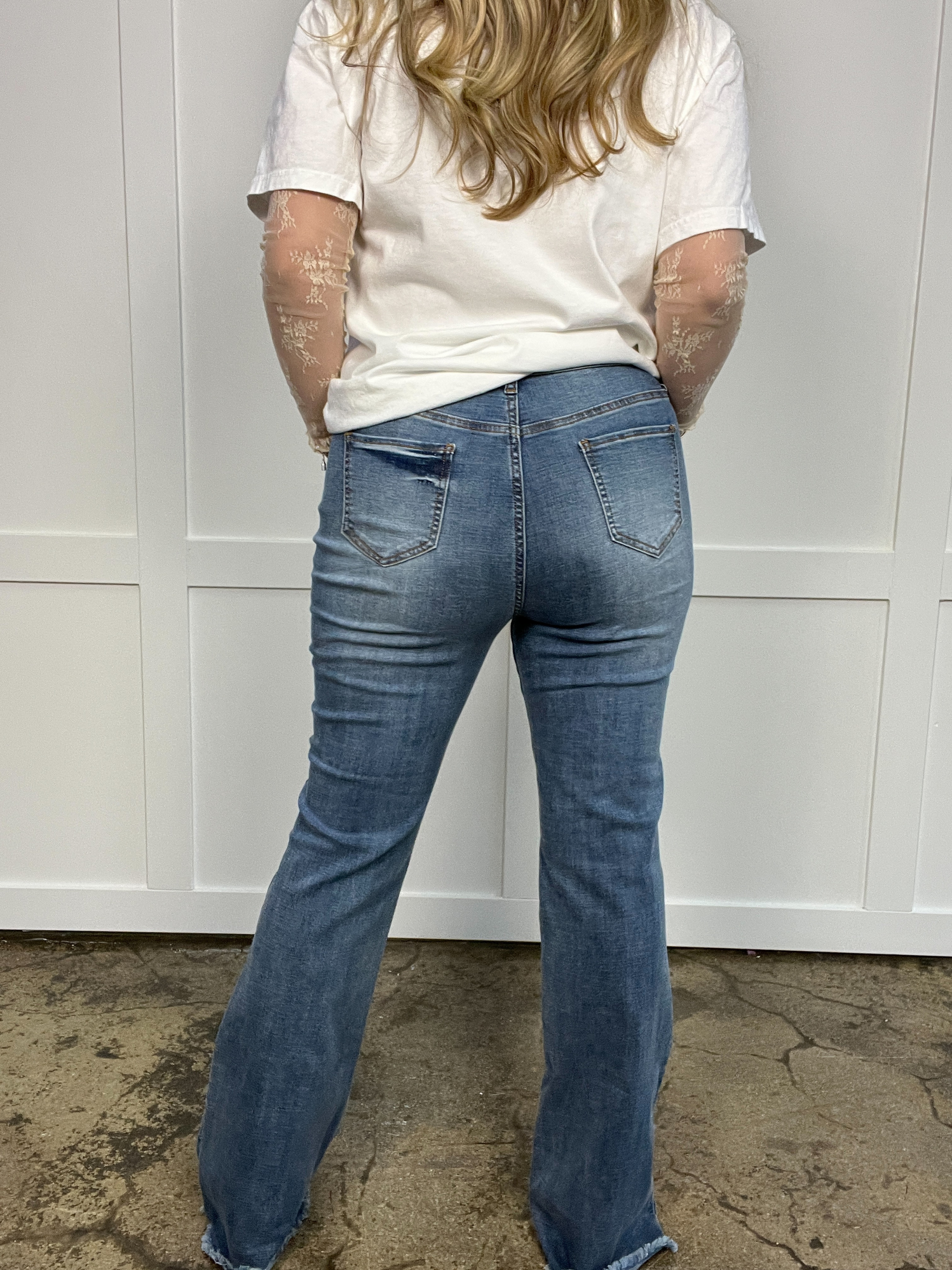 Buy our "Sarah Distressed Medium Wash Flares" online – Willow Boutique Clothing. Shop stylish Sarah Distressed Medium Wash Flares today.
