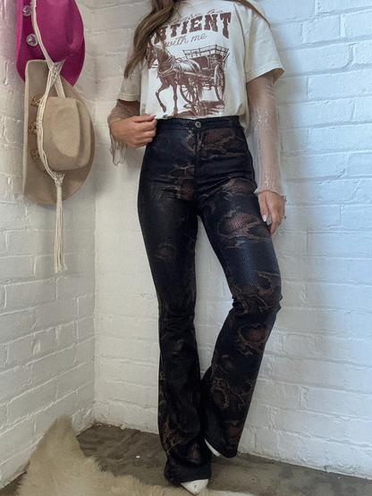 Buy our "Fiona High Waisted Bell Bottom Flare Jeans - Snakeprint" online – Willow Boutique Clothing. Shop stylish Fiona High Waisted Bell Bottom Flare Jeans - Snakeprint today.