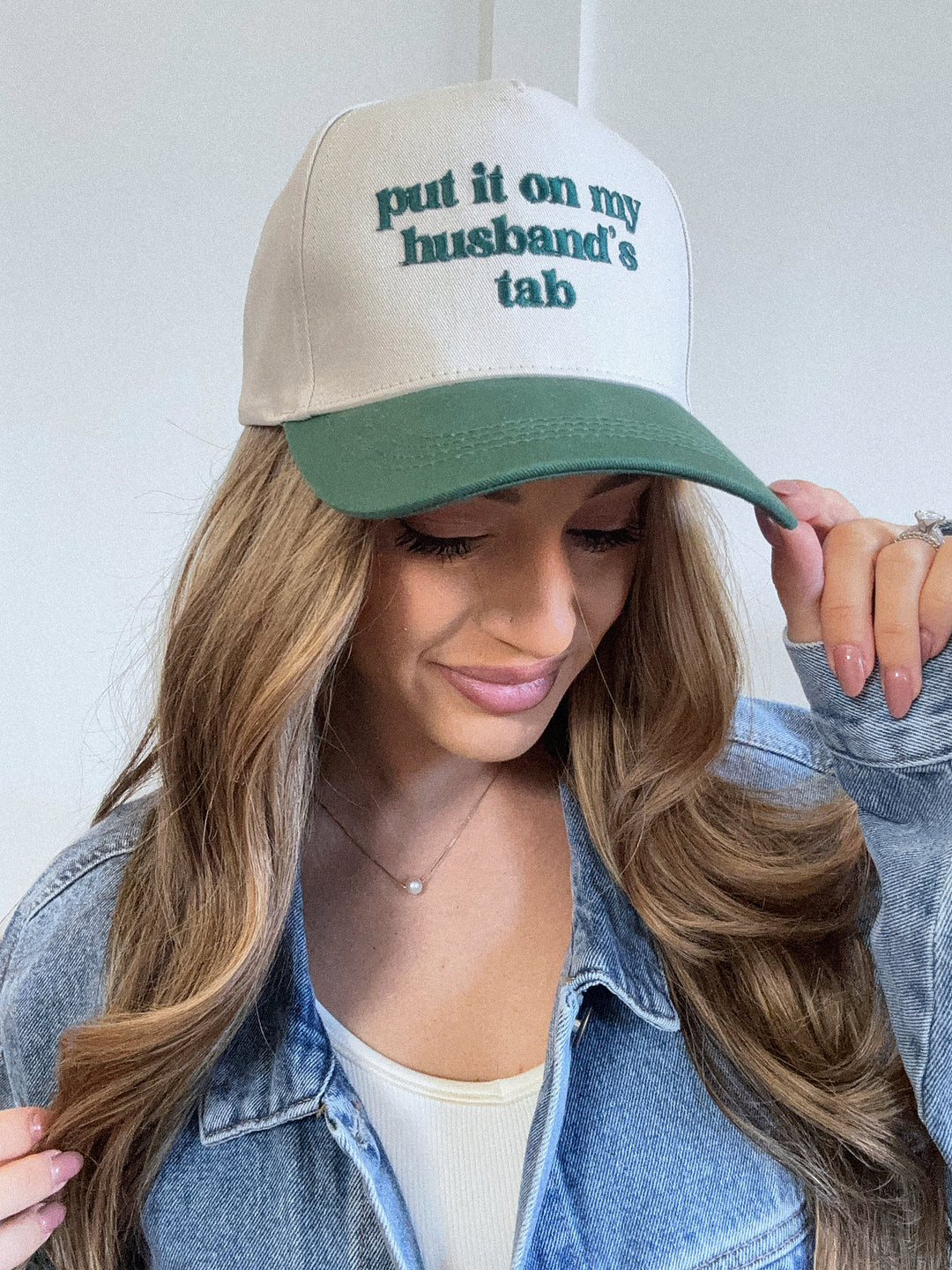 Put It On My Husbands Tab Trucker Hat