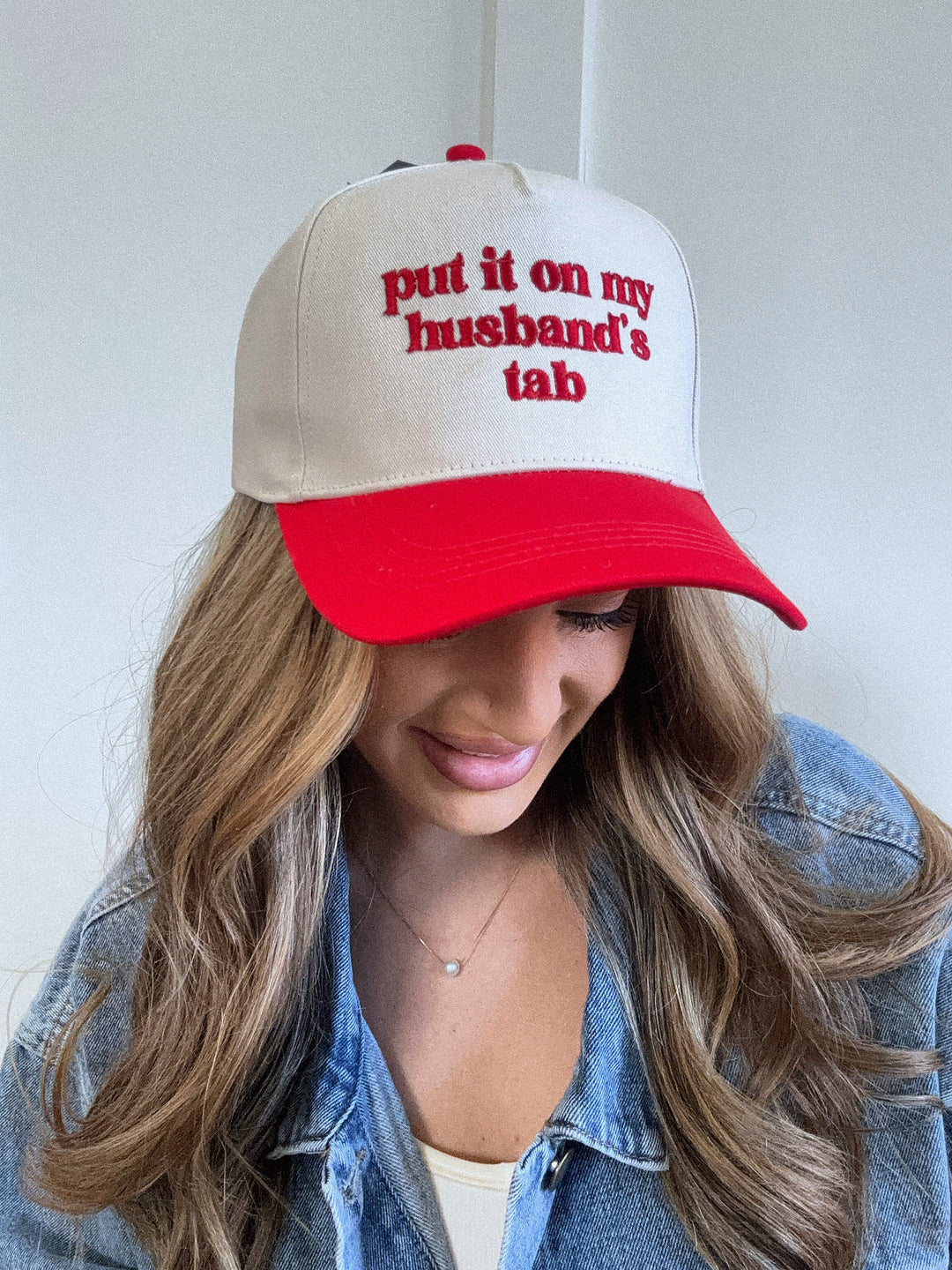 Put It On My Husbands Tab Trucker Hat