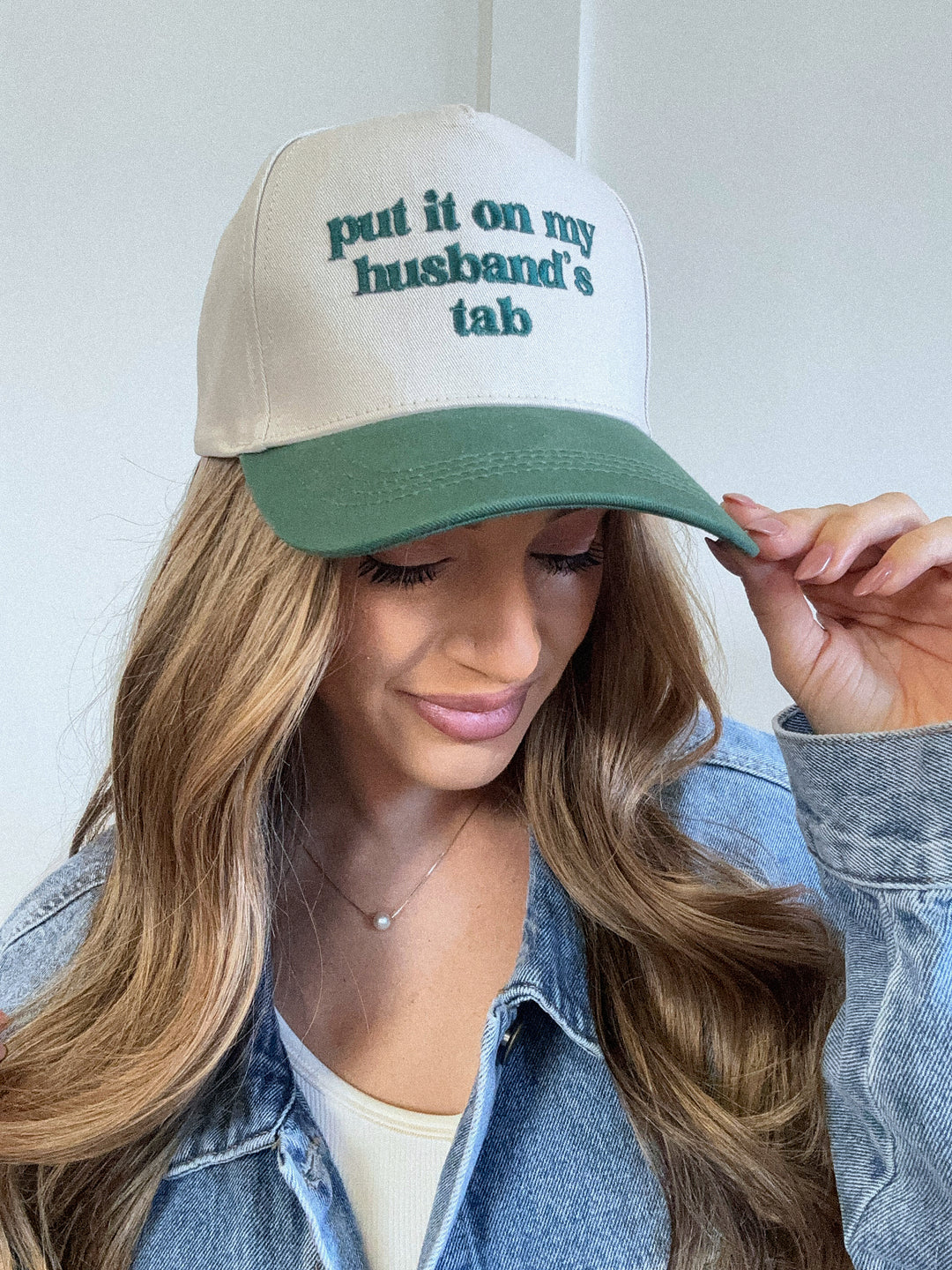 Put It On My Husbands Tab Trucker Hat