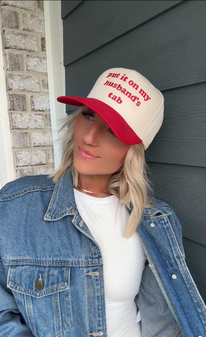 Put It On My Husbands Tab Trucker Hat