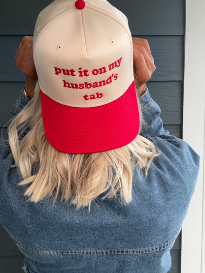 Put It On My Husbands Tab Trucker Hat