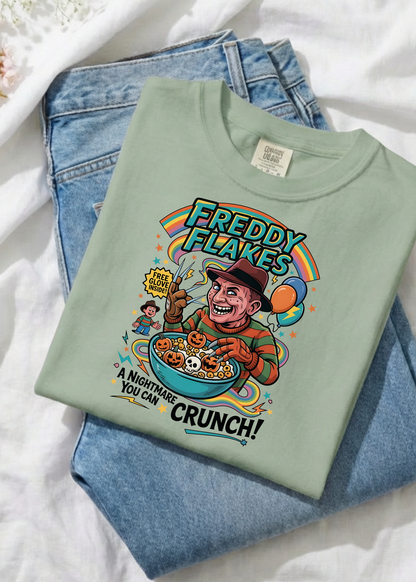 Light green t-shirt with 'Freddy Flakes' graphic design on a white background