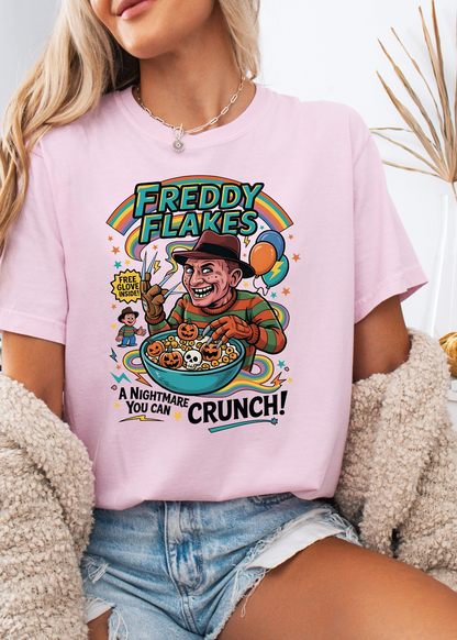Person wearing a pink t-shirt with a colorful graphic design featuring Freddy Krueger from 'A Nightmare on Elm Street'.
