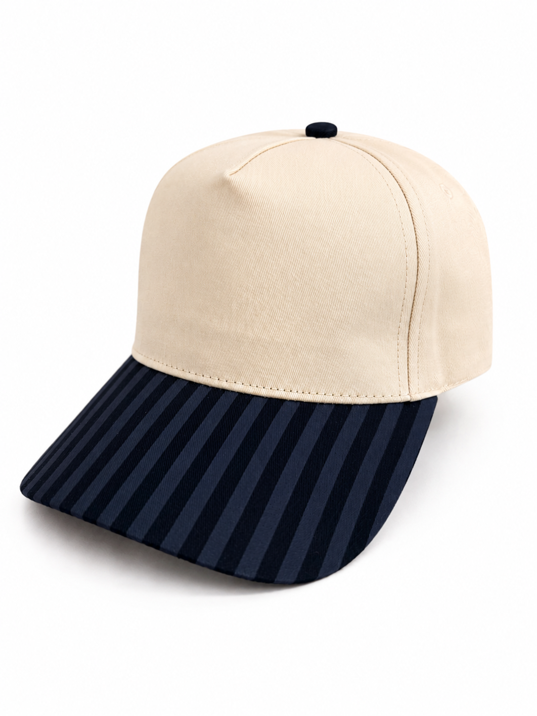 Beige and navy striped baseball cap on a white background