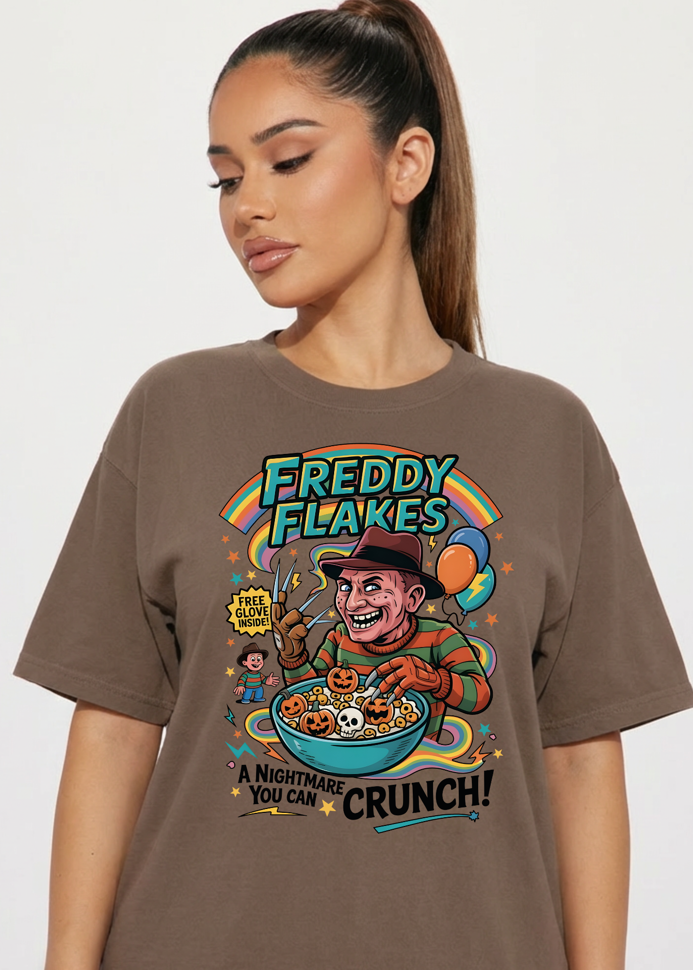 Person wearing a brown t-shirt with 'Freddy Flakes' graphic design.