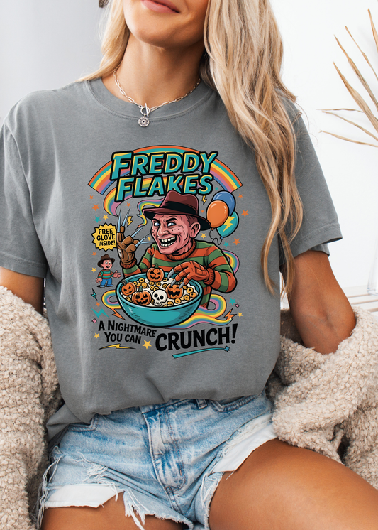 Person wearing a gray t-shirt with a colorful graphic design featuring a character and text.