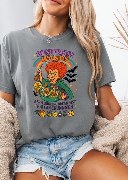 Person wearing a gray t-shirt with a colorful graphic design featuring a character and text.