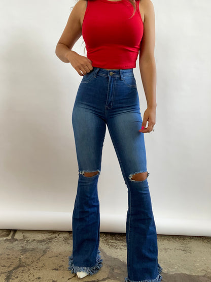 Buy our "Farrah Denim Distressed High Waisted Flares - Medium Wash" online – Willow Boutique Clothing. Shop stylish Farrah Denim Distressed High Waisted Flares - Medium Wash today.
