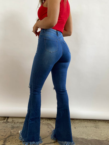 Buy our "Farrah Denim Distressed High Waisted Flares - Medium Wash" online – Willow Boutique Clothing. Shop stylish Farrah Denim Distressed High Waisted Flares - Medium Wash today.