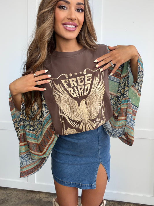 Woman wearing Free Bird Vintage Kantha Top in white shown in front view