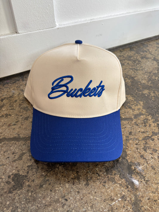 Woman wearing Buckets Trucker Hat in BlueIvory Panel shown in front view