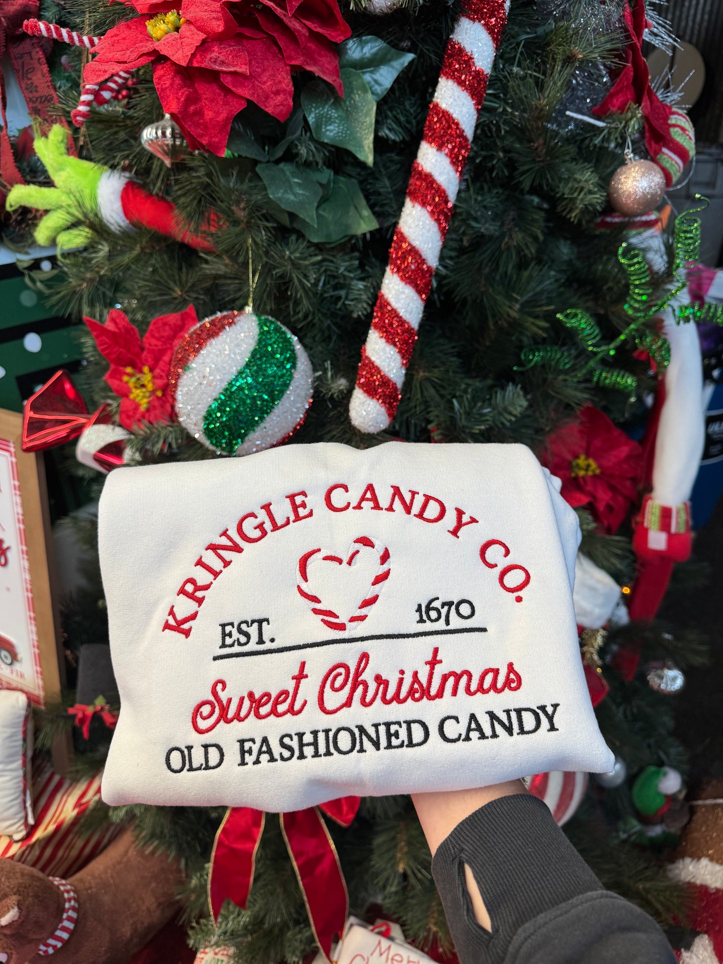 Shop Embroidered Kringle Candy Co. Christmas Crewneck online at Willow Boutique – best boutique for women’s fashion.