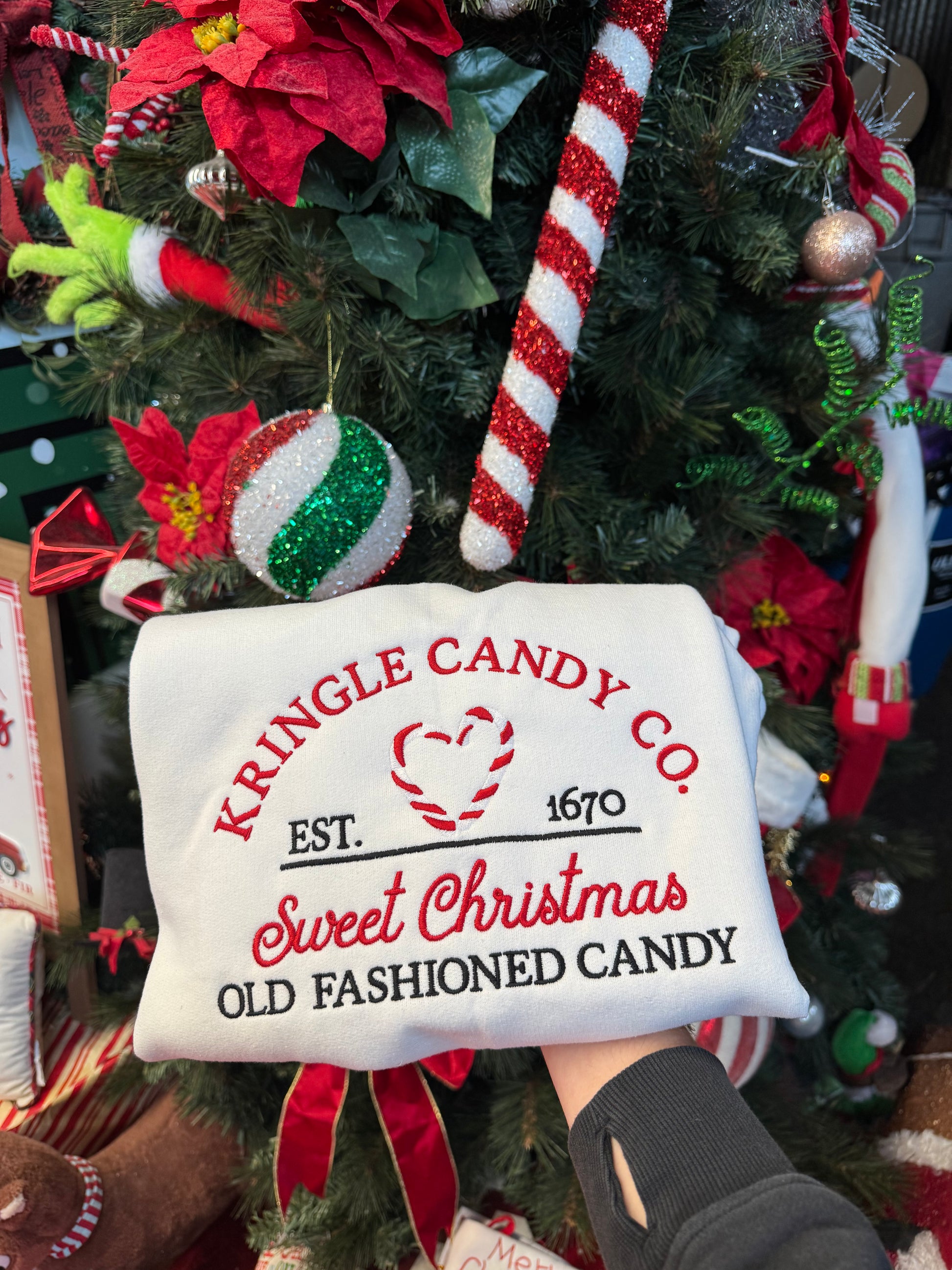 Shop Embroidered Kringle Candy Co. Christmas Crewneck online at Willow Boutique – best boutique for women’s fashion.