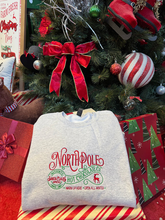 Shop Embroidered "North Pole Hot Chocolate" Holiday Crewneck online at Willow Boutique – best boutique for women’s fashion.