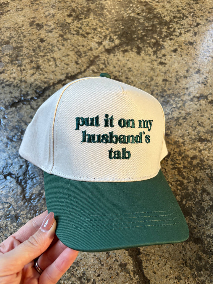 Put It On My Husbands Tab Trucker Hat