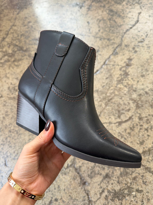 Woman wearing IMPERFECT Of Jolene Embroidered Pointed Heeled Ankle Booties in Black shown in front view