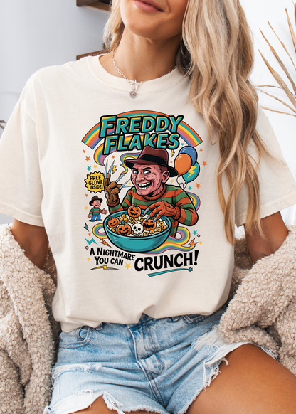 Person wearing a white t-shirt with a colorful graphic design featuring a character and text.