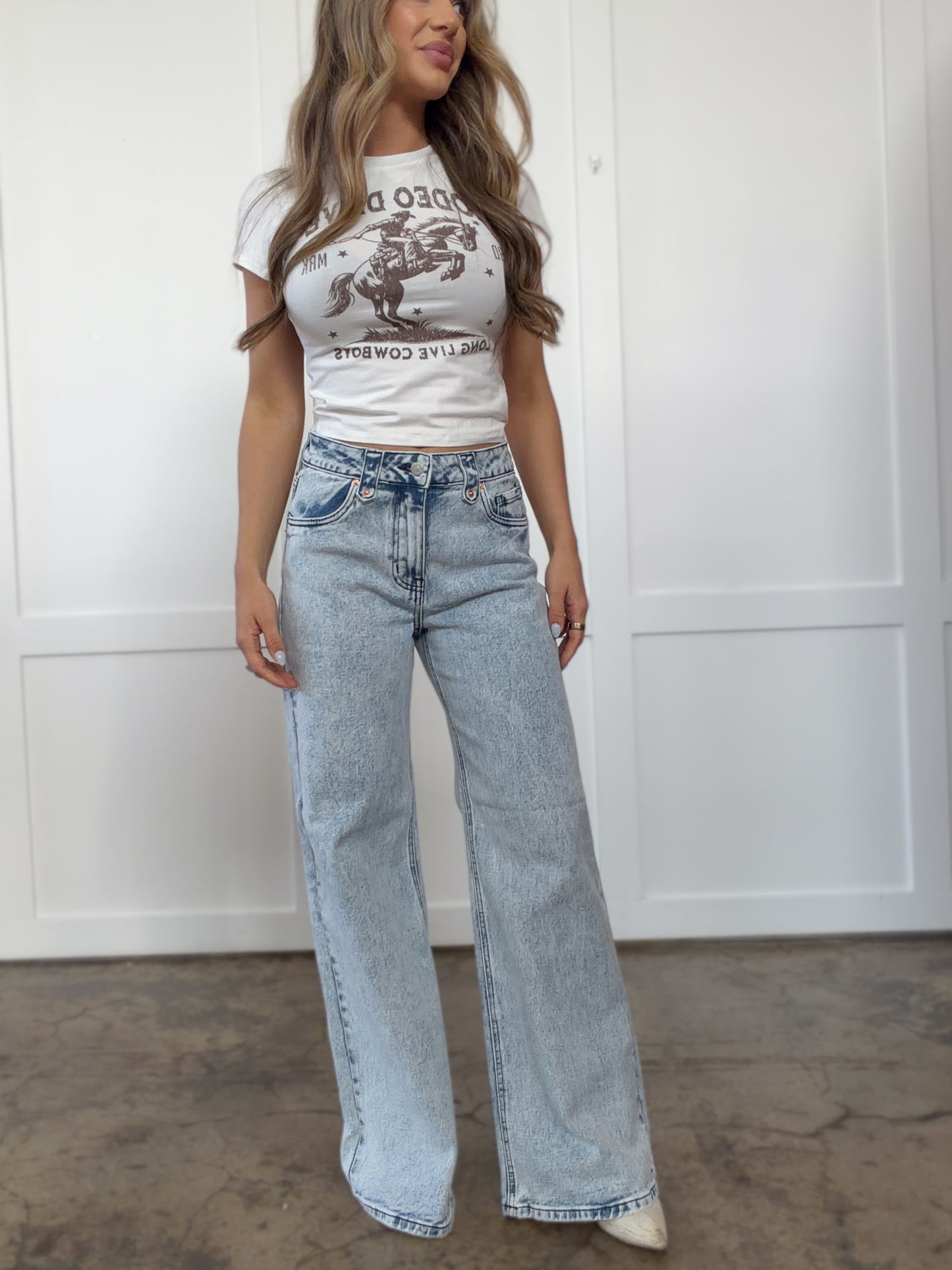Woman wearing  in mediumwash shown in back view
