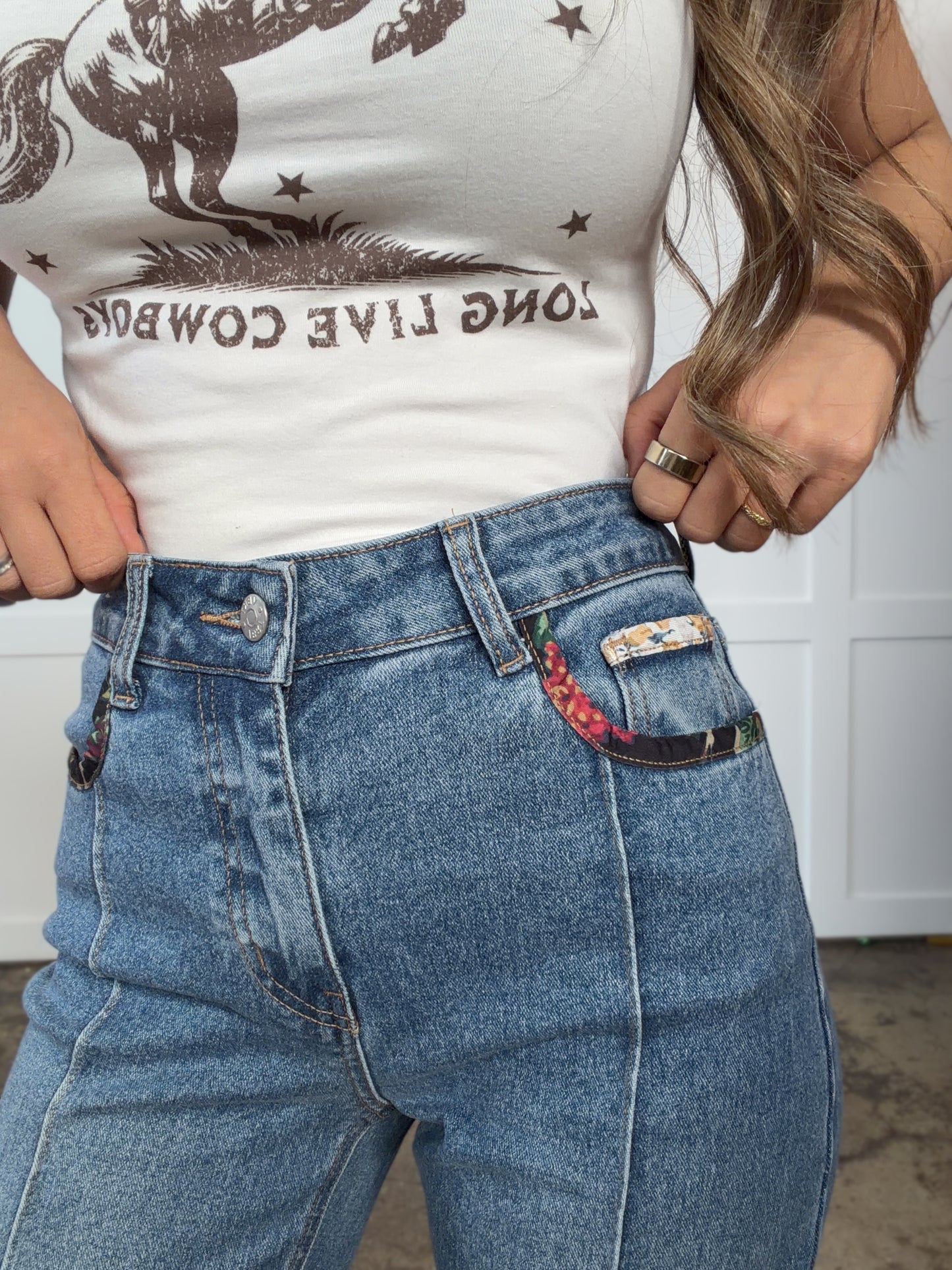 Woman wearing  in mediumwash shown in back view