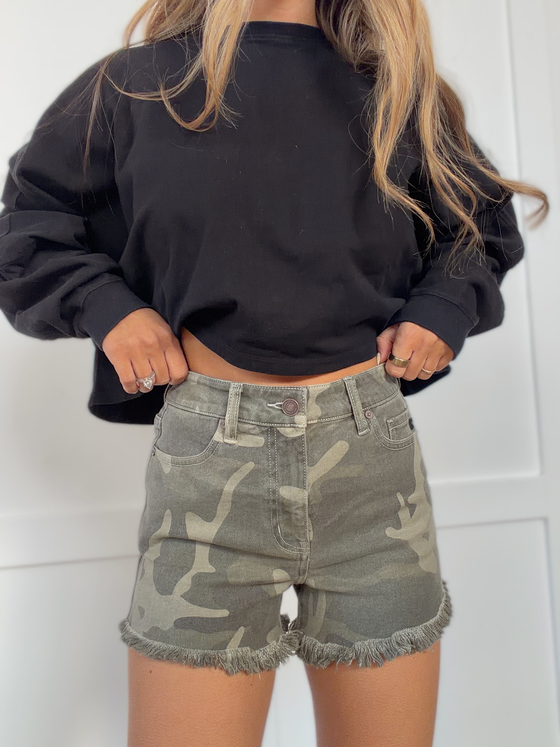 Woman wearing  in camouflage shown in back view