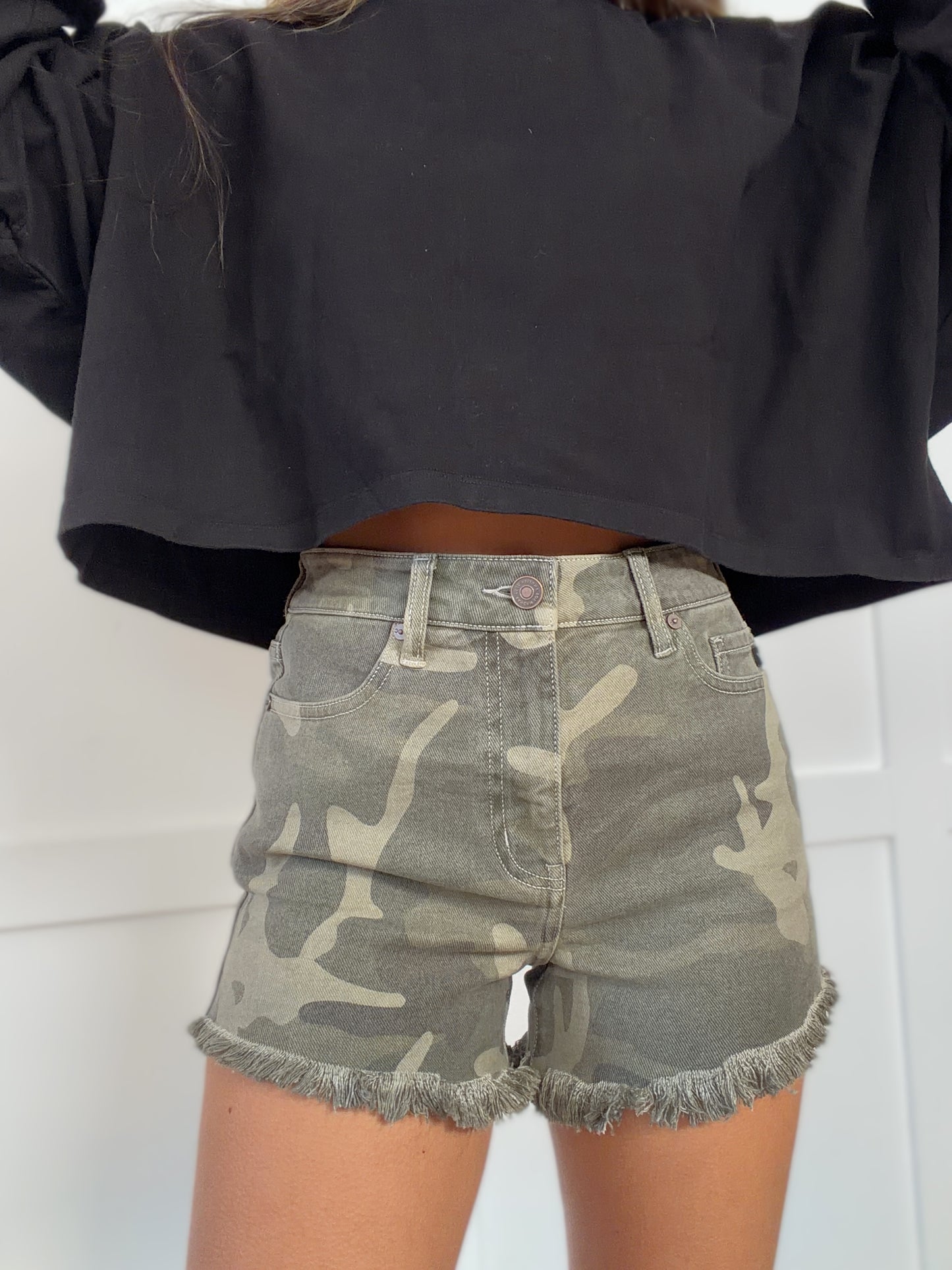 Woman wearing  in camouflage shown in detail view