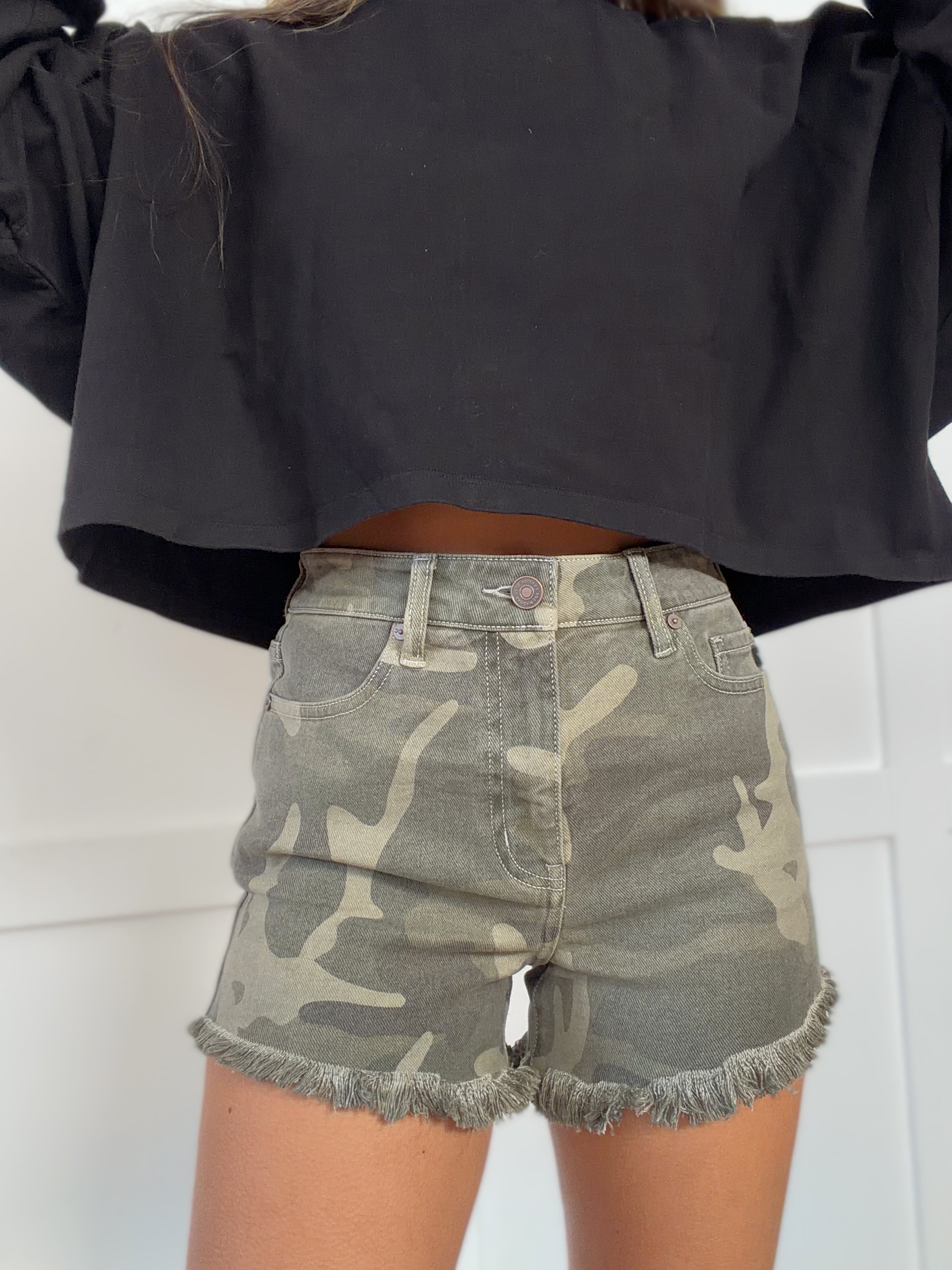 Woman wearing  in camouflage shown in detail view