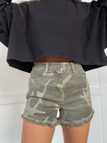 Woman wearing  in camouflage shown in detail view