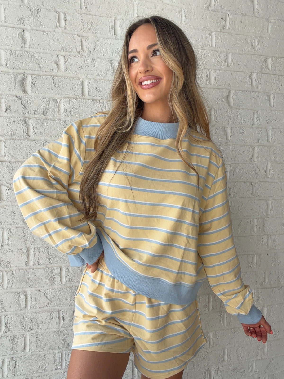 Angled view of the Marigold Morning striped lounge top