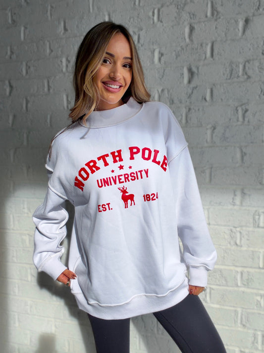 Chelsea modeling white Tilly oversized mockneck with red North Pole University print